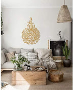 Shahada Tropfen Gold aus Metall an der Wand